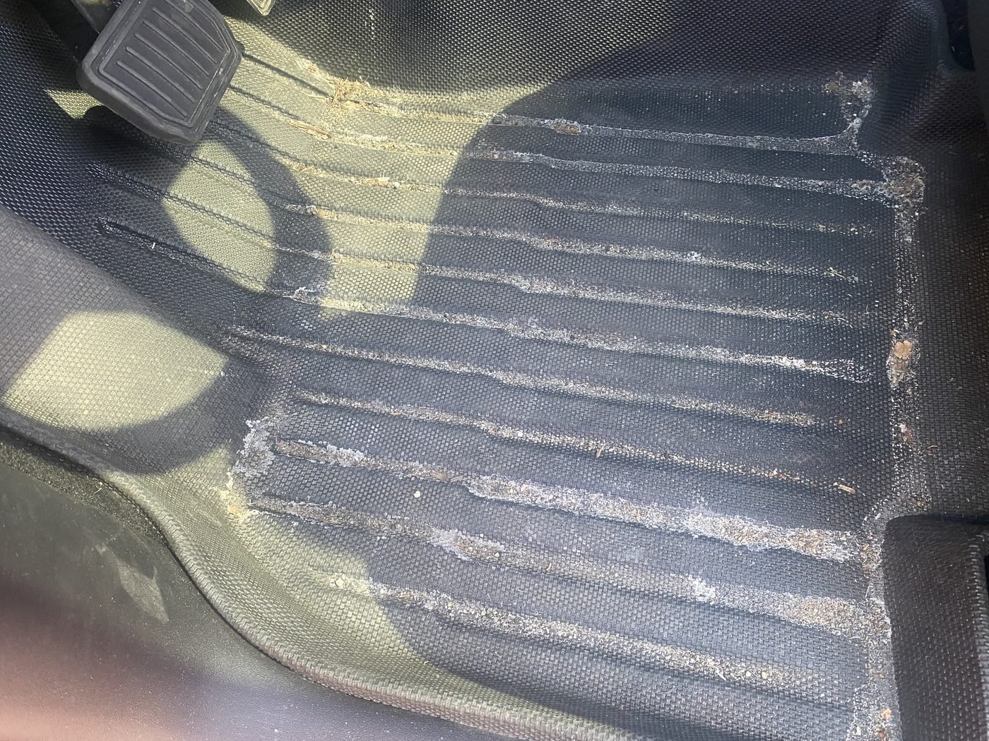 Salt-crusted floor mat before interior detailing